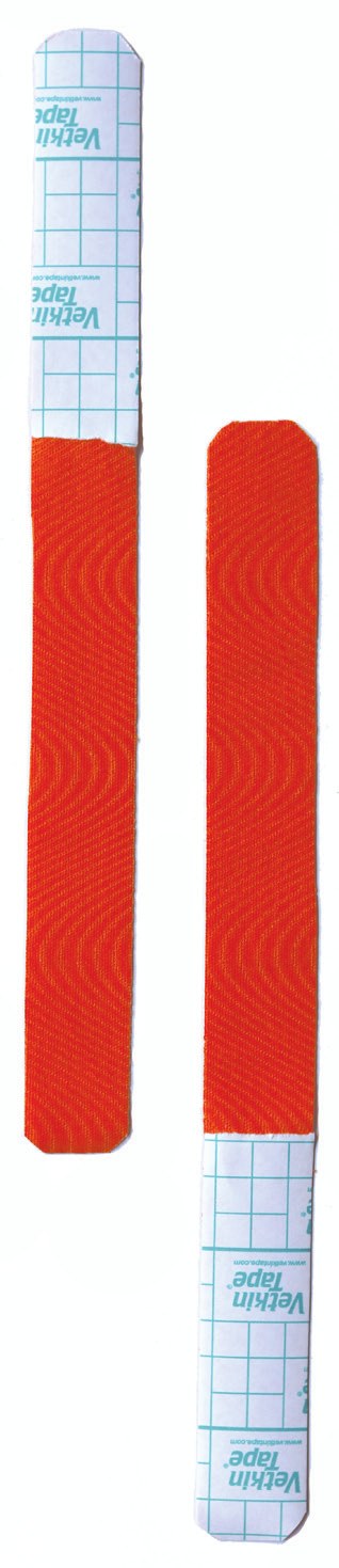 Two I-strips of tape with backing paper partly removed